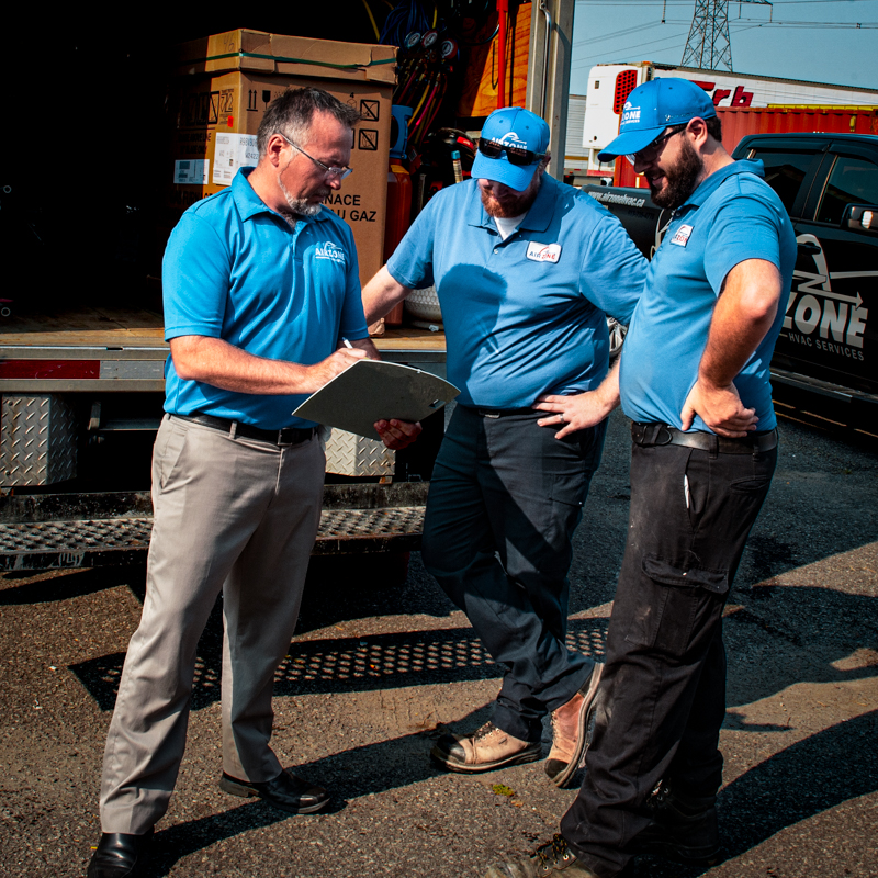AirZone technicians reviewing an Ottawa heating system