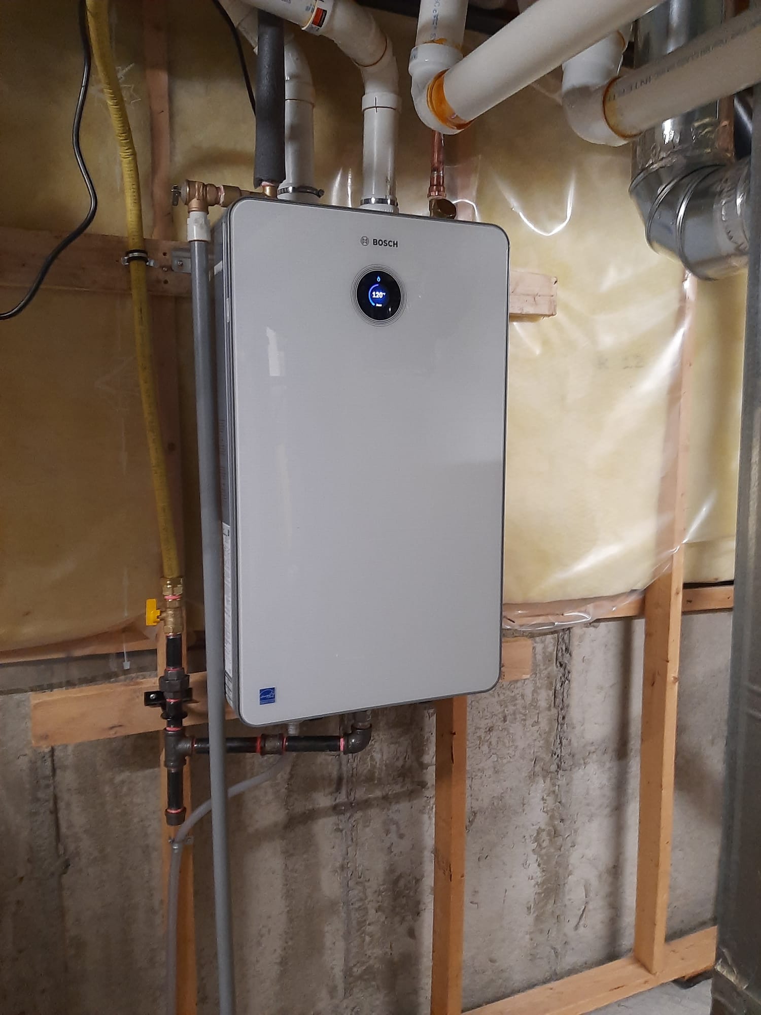 Wall-hung Bosch high-efficiency boiler installed in an Ottawa mechanical room