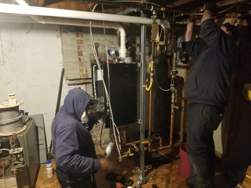AirZone technicians repairing and upgrading a residential boiler system in Ottawa
