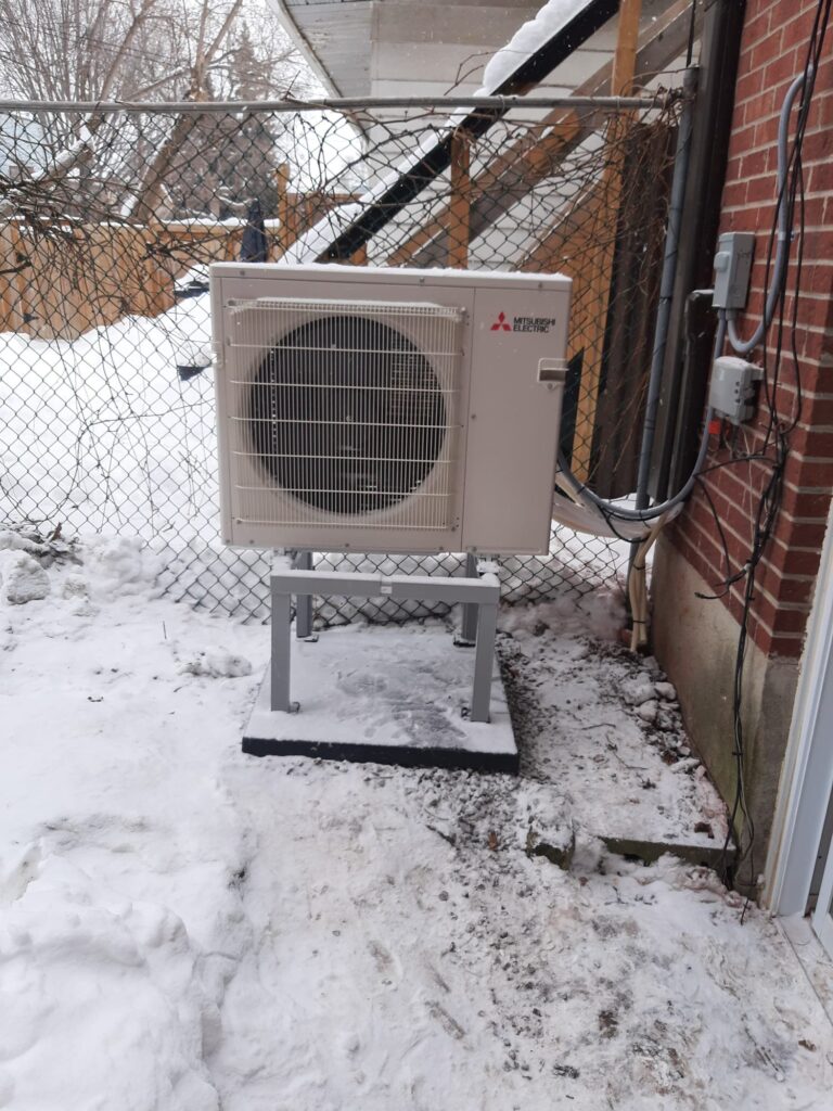 Mitsubishi outdoor heat pump installed by AirZone in winter