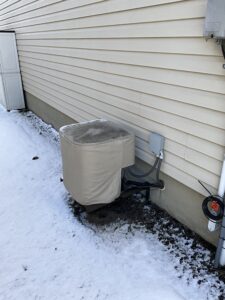 Should You Cover an Air Conditioner for Winter? - AirZone HVAC Services - AirZone HVAC Services A covered air conditioner installed in Ottawa by AirZone HVAC Services.