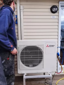 A ductless system with two indoor heads. One is upstairs and one is downstairs offering heating and air conditioning.