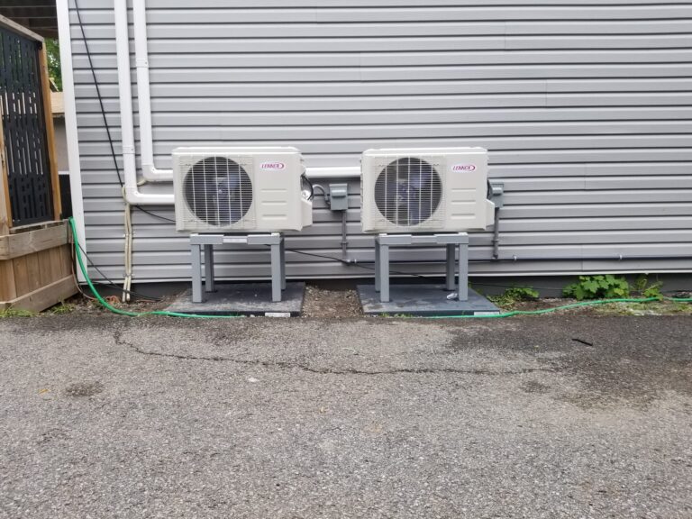 Two Lennox MHA outdoor units installed on stands by AirZone