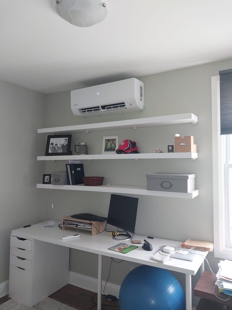 Lennox indoor unit installed above shelving in a living space