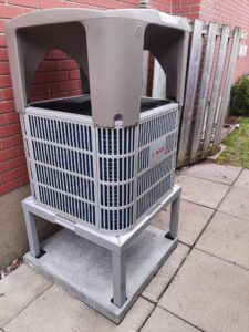 Heat pump installed with protective cover in Alta Vista area of Ottawa by advanced hvac technicians at AirZone HVAC Services.
