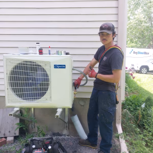Ottawa HVAC Services - AirZone HVAC Services Ottawa HVAC Services being performed on a new heat pump by AirZone HVAC Services